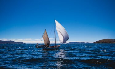 Traditional sailing boats on Lake Titicaca near Luquina – Community Homestay Lake Titicaca experience.