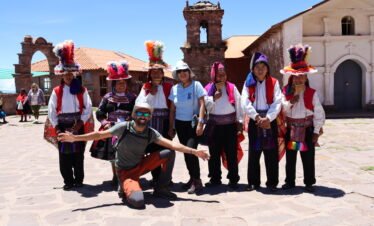 Quechua community members in traditional clothing on Taquile Island during a 3 day Lake Titicaca homestay, Peru