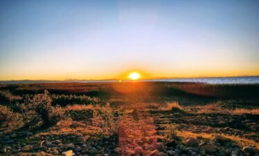 Magnificent sunset over Lake Titicaca from scenic viewpoint in Luquina Chico Puno Peru