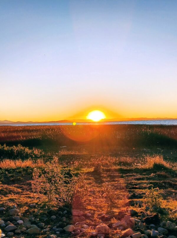 Magnificent sunset over Lake Titicaca from scenic viewpoint in Luquina Chico Puno Peru
