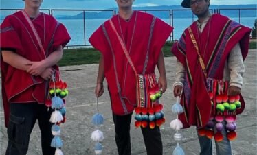 Travelers wearing traditional Aymara clothing from Luquina Chico, Lake Titicaca, Peru