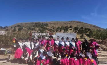Volunteers and host family gathered after shared experiences in Luquina Chico by Lake Titicaca Puno Peru