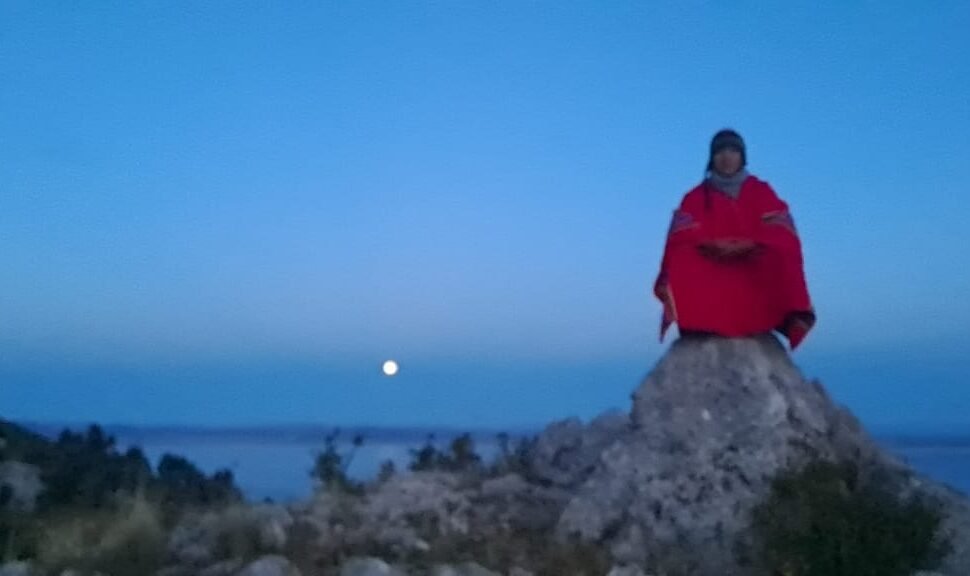 Sunrise over Lake Titicaca with the moon
